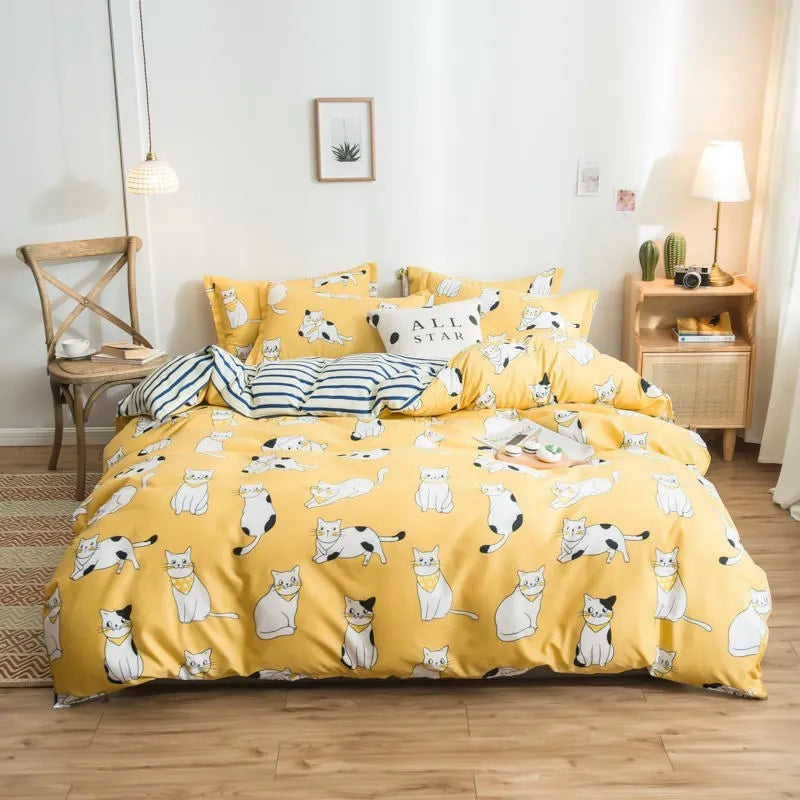 Cotton duvet cover and fitted sheet bedding set in a colour option, shown on a bed