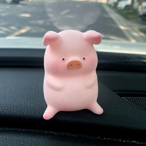 Cute cartoon pig resin figurine car dashboard ornament in one of eight available styles.