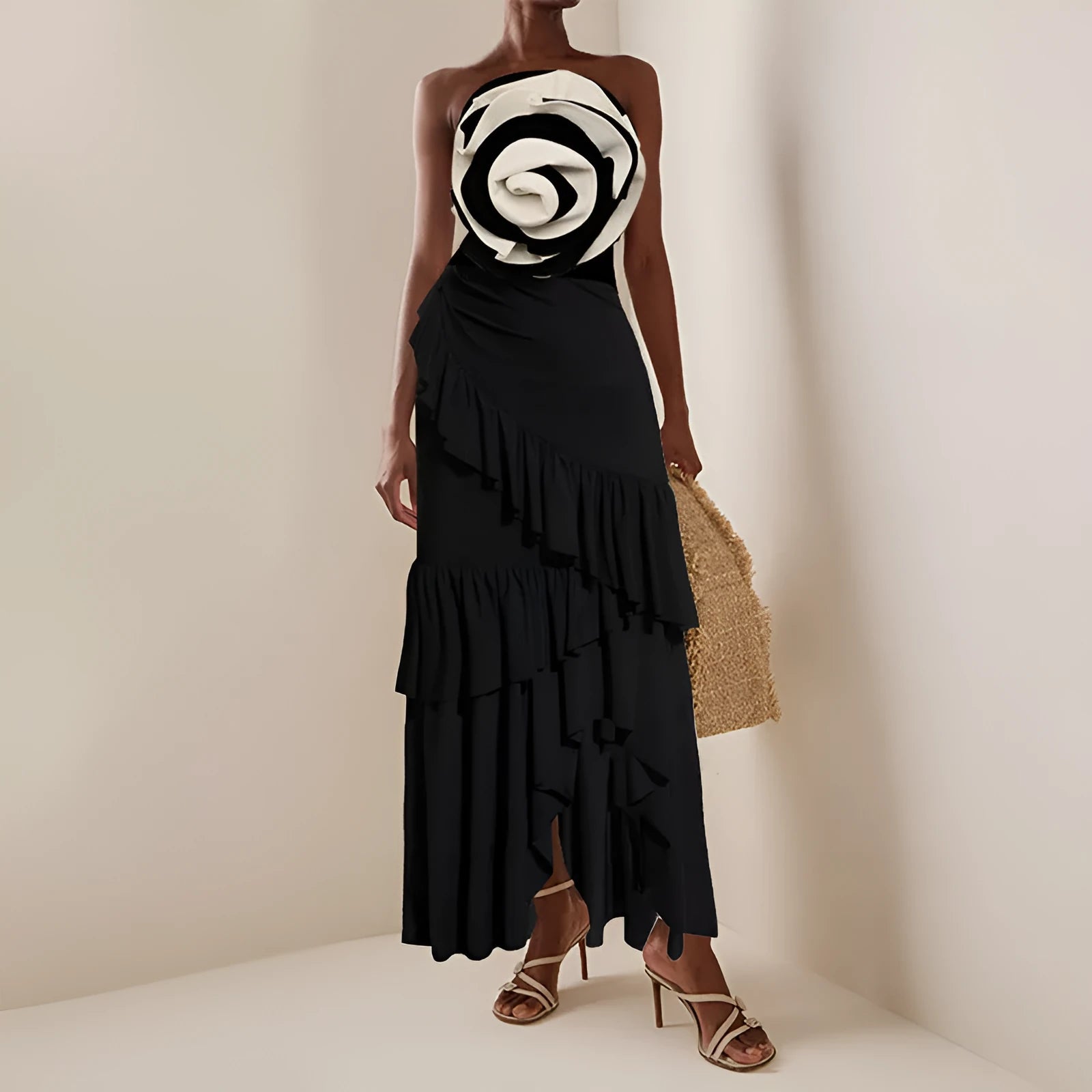 Women's black and white one-piece swimsuit with a detachable matching skirt on a beach.