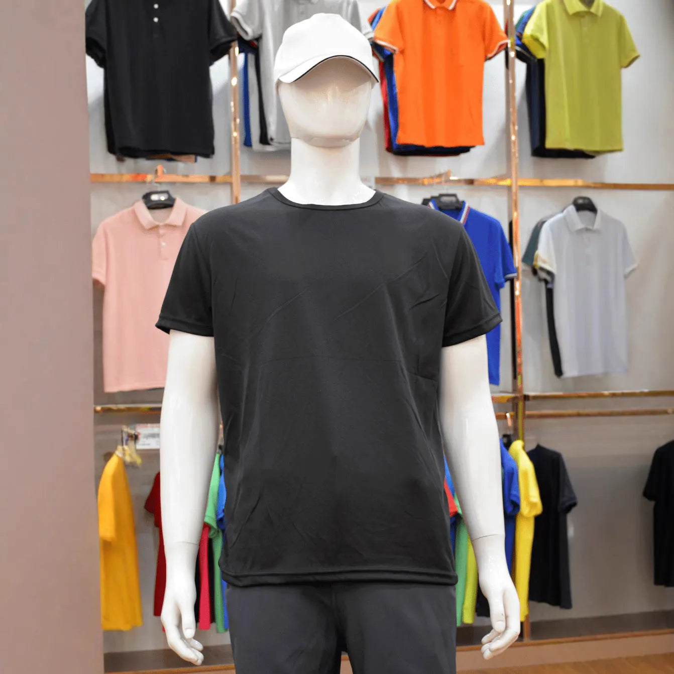 Man wearing a slim fit short sleeve round neck T-shirt in a solid colour.