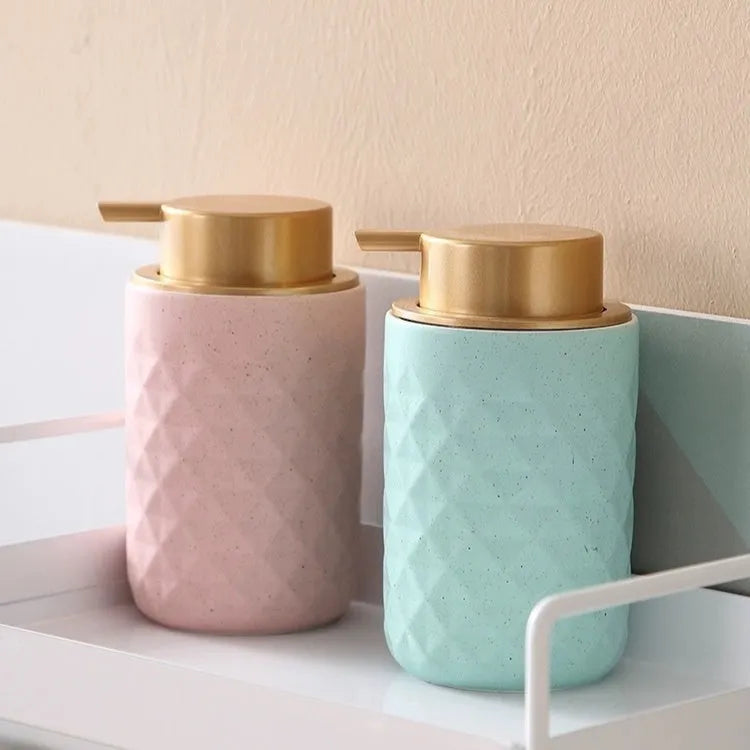 Foam pump facial cleanser dispenser with hand push mechanism in metallic finish