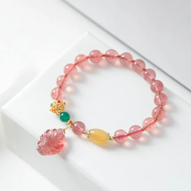 Women's strawberry quartz crystal bracelet with nine tail fox bead design