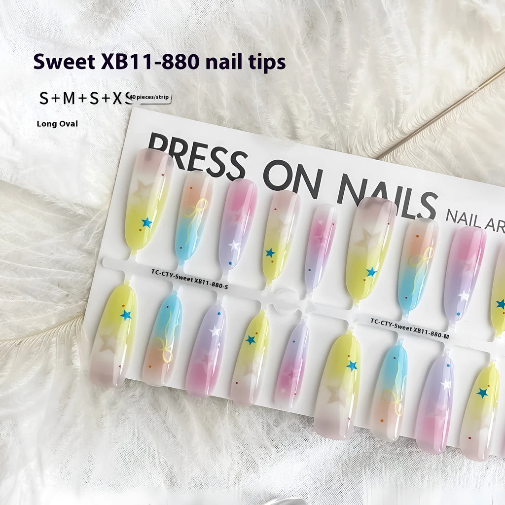 Dopamine Cartoon XINGX oval almond nail sticker set in sweet XB11-880 colour, natural frosted non-sealing layer, on a woman's nails.