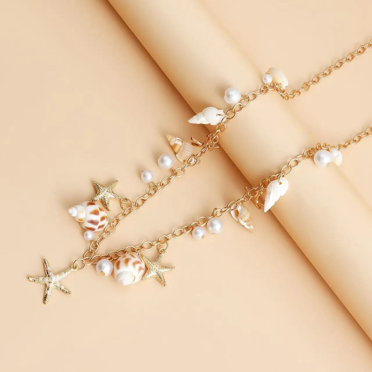 Women's star-shaped waist chain and matching bracelet jewellery set for summer beach festivals