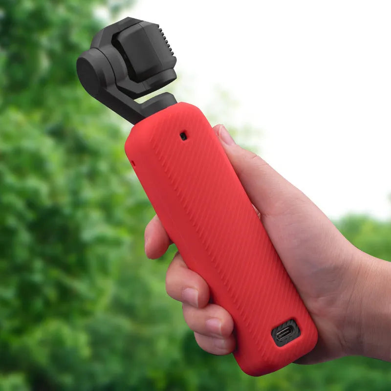 Black silicone protective sleeve for a PTZ camera, shown next to red and orange versions.