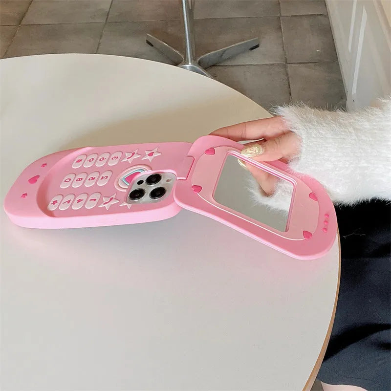 Pink silicone flip phone case with a mirror for iPhone models.