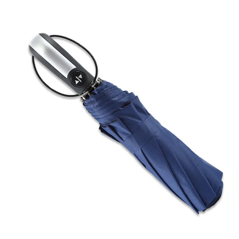Black triple-fold automatic umbrella with palace-style canopy, shown open to demonstrate 110cm coverage.