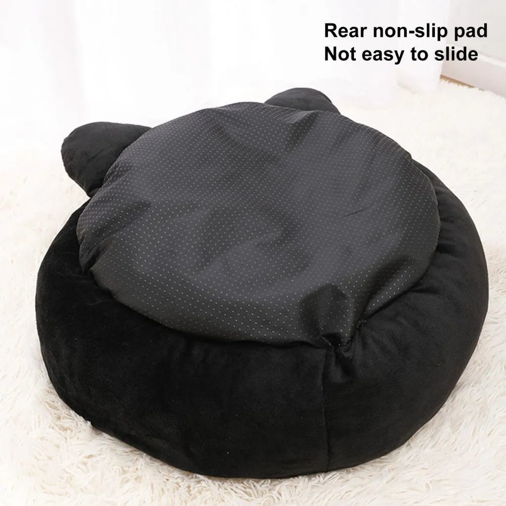 Black cat-shaped velvet pet bed with raised edges for head support in two size options