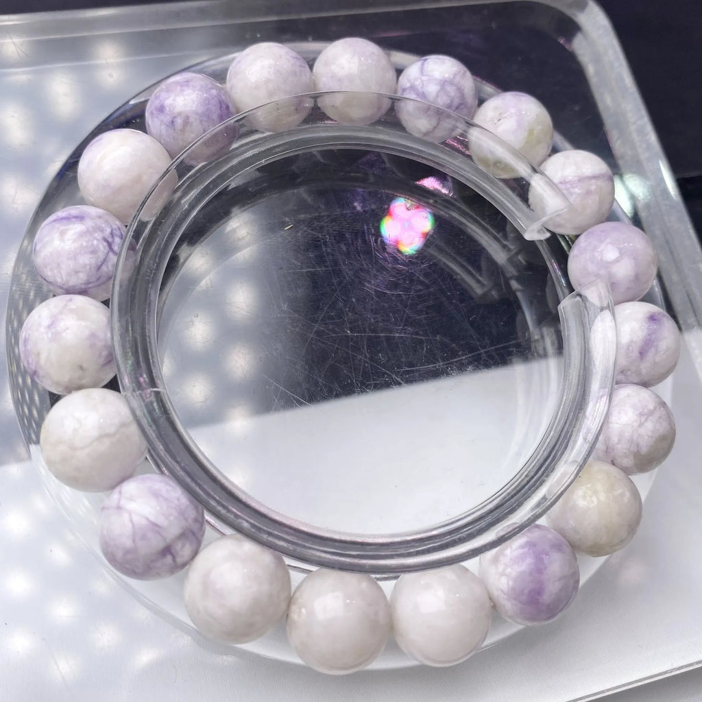 A natural purple turquoise bead bracelet for women, shown in a choice of 6mm, 8mm, or 10mm bead sizes.