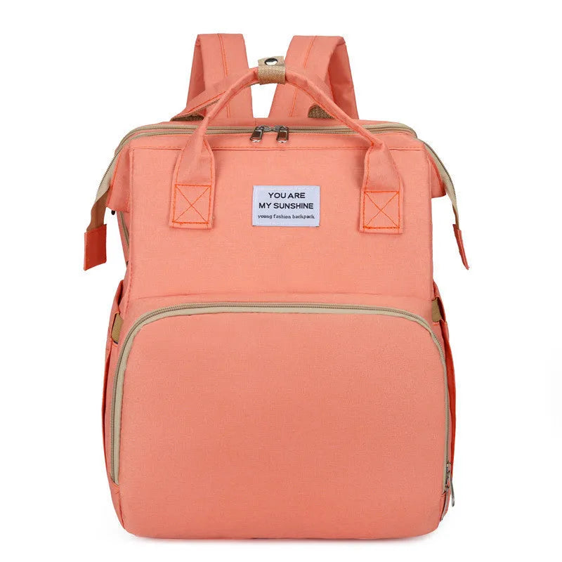 Lightweight nylon mummy bag with USB port and curved shoulder strap in multiple colour options.