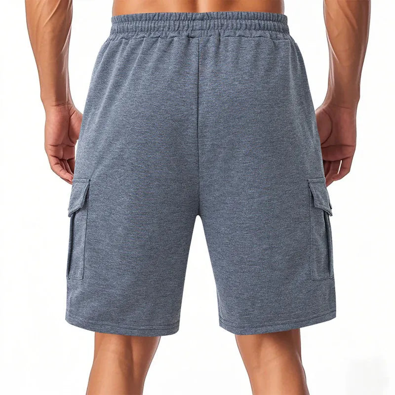 Light grey loose-fit cargo shorts made from soft terry fabric, showing multiple pockets.