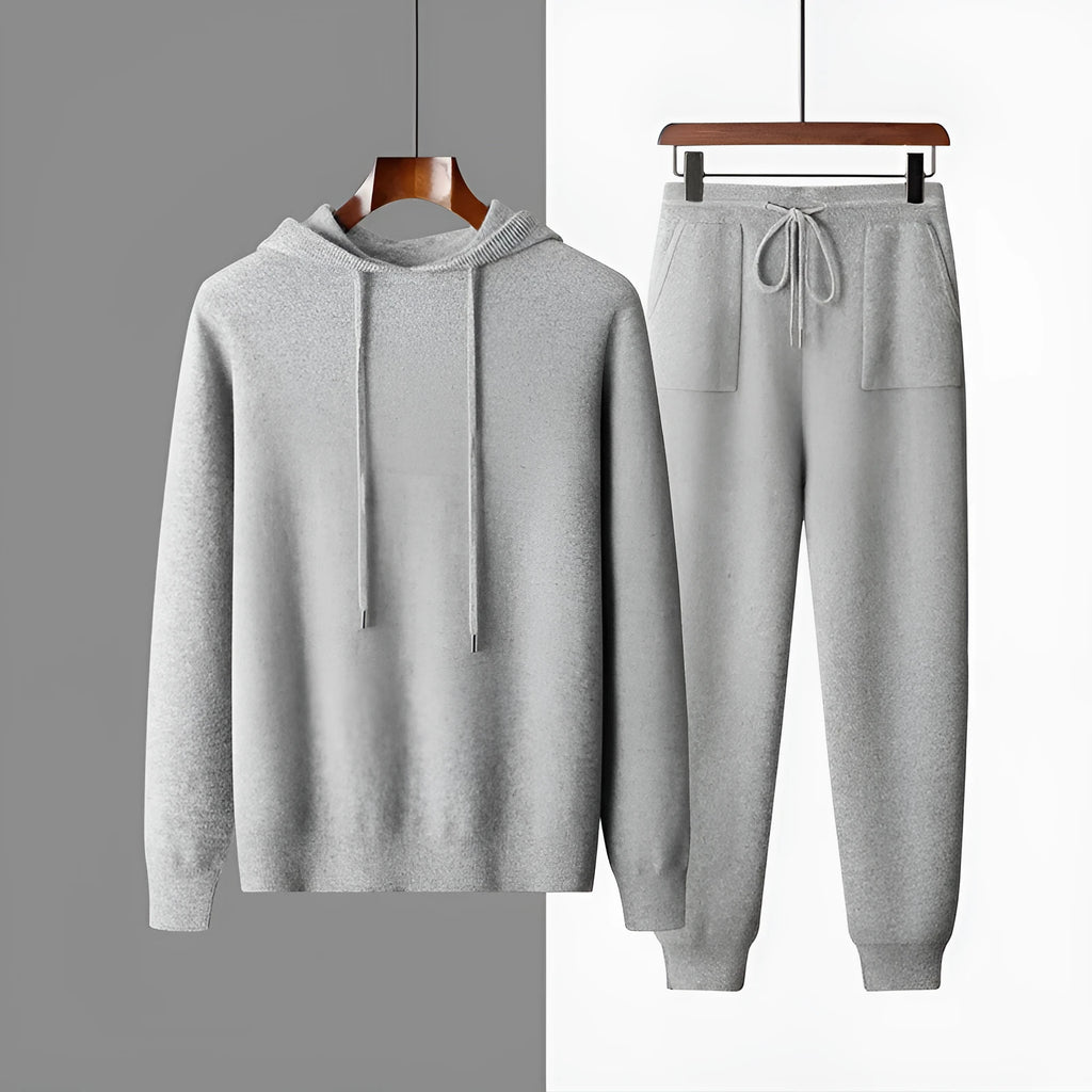 Men's light grey cashmere hooded sweatshirt and trouser set laid flat