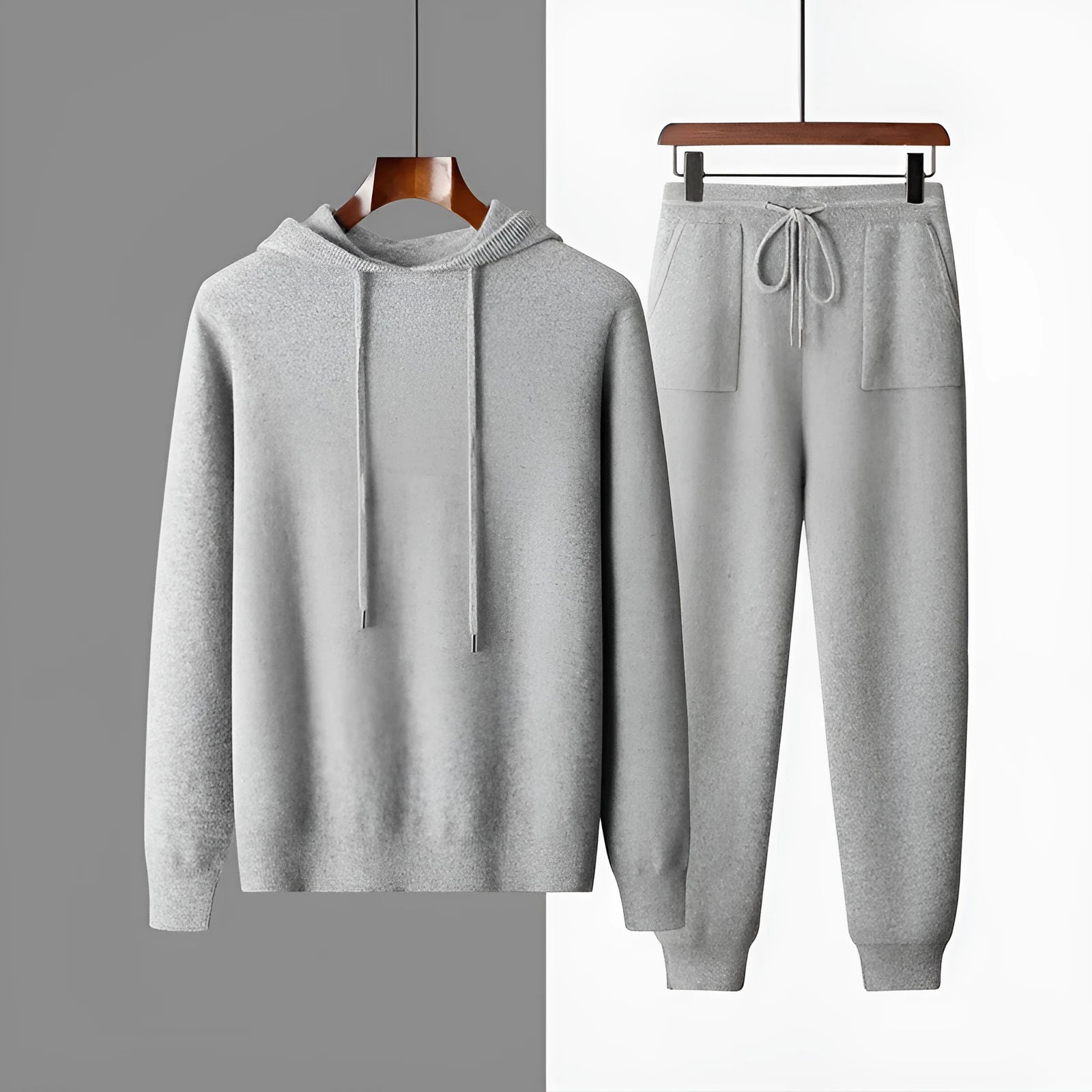 Men's light grey cashmere hooded sweatshirt and trouser set laid flat