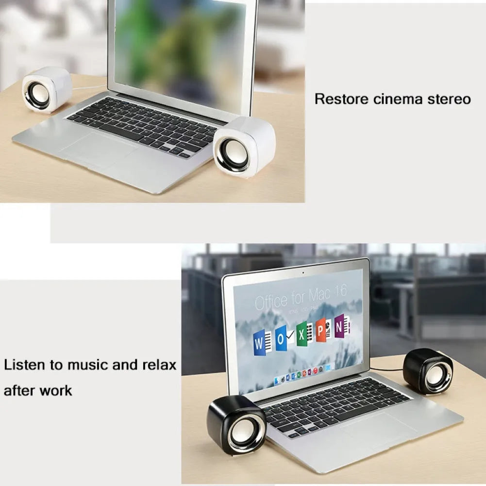 A pair of small black wired computer speakers with a volume scroll wheel, shown next to a 3.5mm audio plug on a desk.