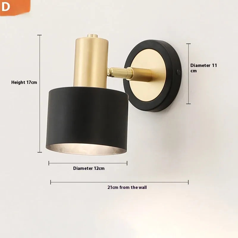Nordic-style iron wall lamp mounted on a wall beside a bed.