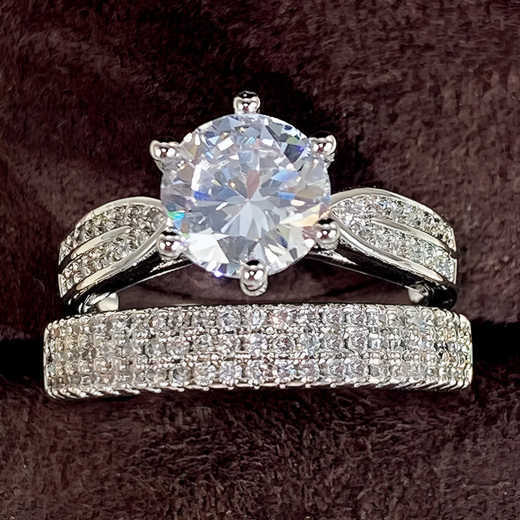 Geometric white gold colour alloy ring and bracelet combined into one continuous piece on a model's hand.