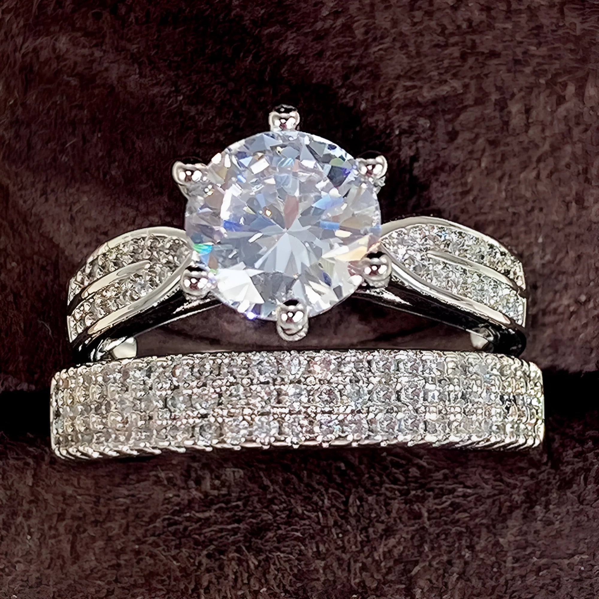 Geometric white gold colour alloy ring and bracelet combined into one continuous piece on a model's hand.