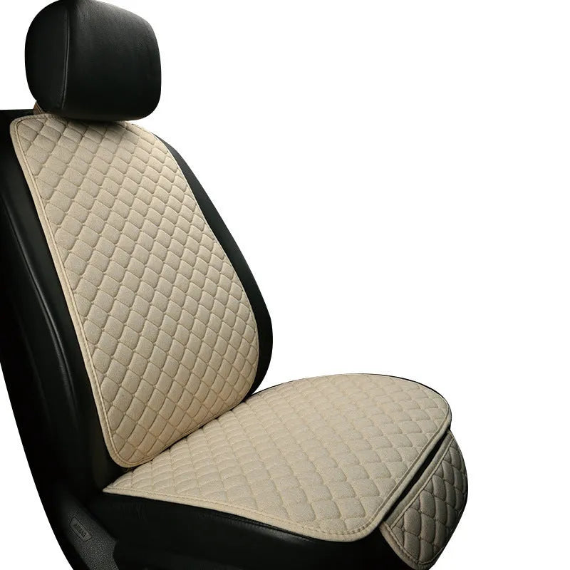 Linen car seat cushion with memory foam in Warm Cream colour on a car seat.