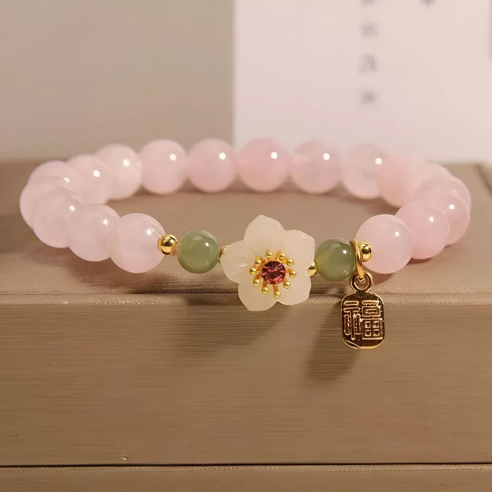 Polished crystal Hetian jade beaded bracelet with peach blossom and camellia pastoral design in blessing card colour