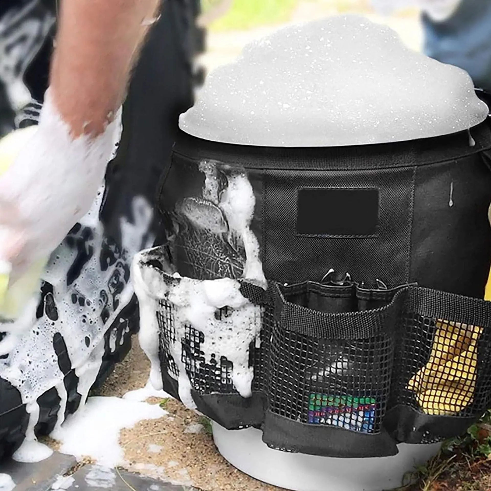 Black cylindrical polyester hanging storage bag attached to a 5-gallon barrel.