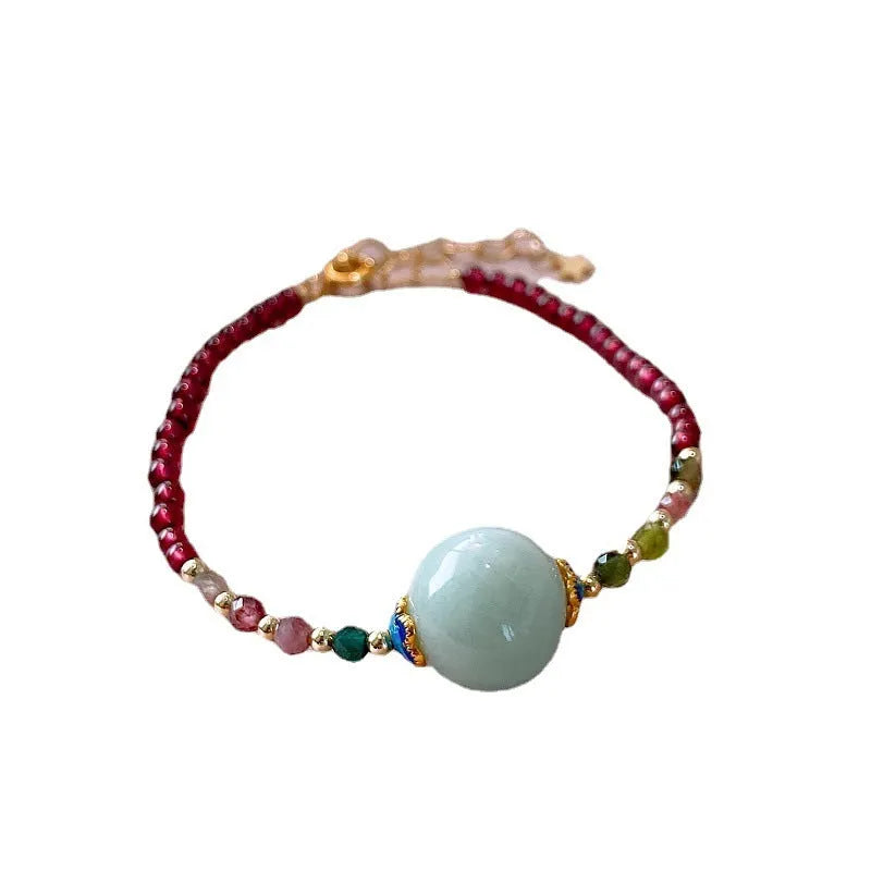 Simple aquamarine garnet bracelet with drop-shaped tourmaline stones and electroplated metal components