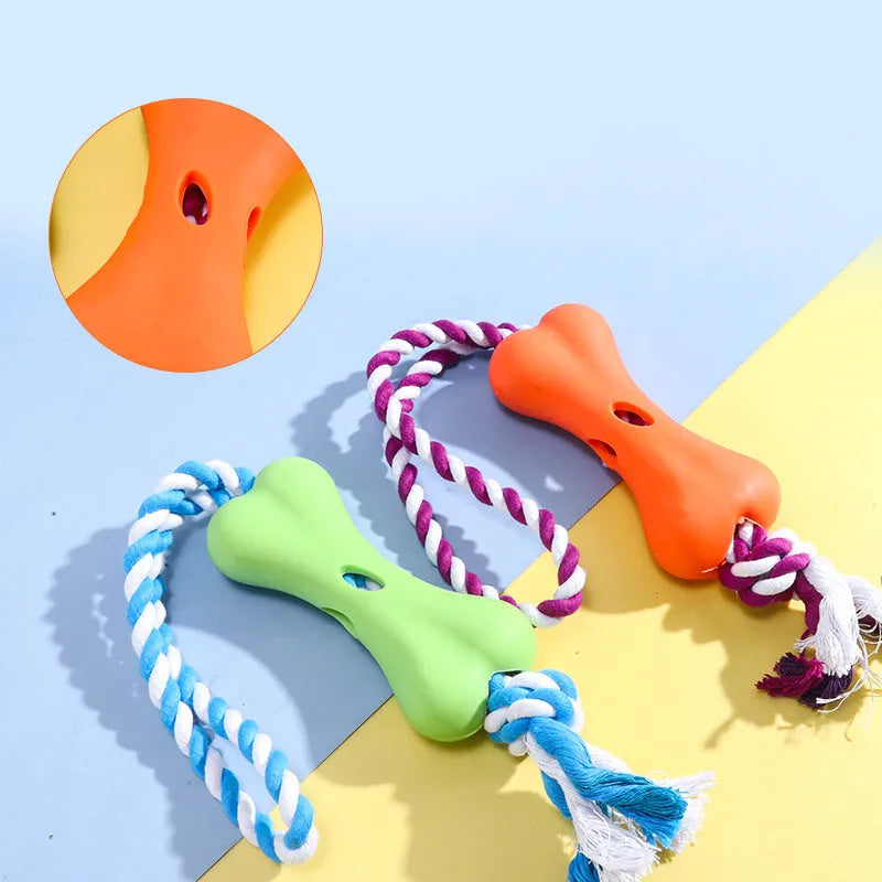 Green porous bone dog toy with rope knots for inserting treats, measuring 138x59x35mm