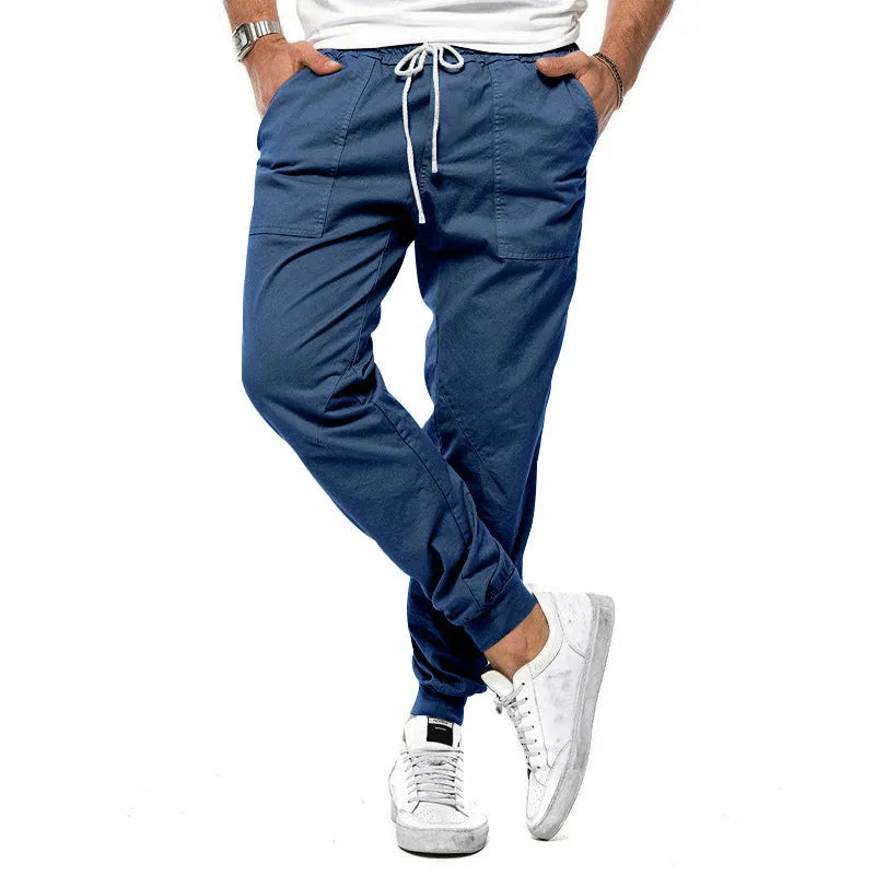 Men's loose tapered casual trousers with drawstring waist and ankle bands in solid colour