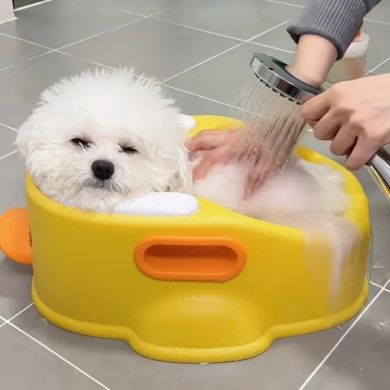 Blue PVC pet bathtub shaped like a duck for washing small dogs and cats.
