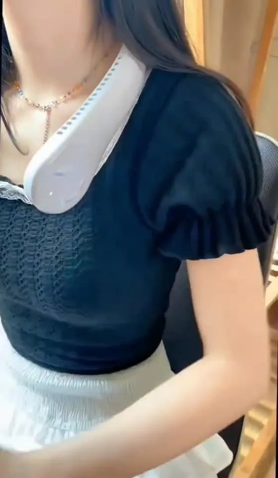 Pink USB rechargeable portable bladeless neck fan being worn.