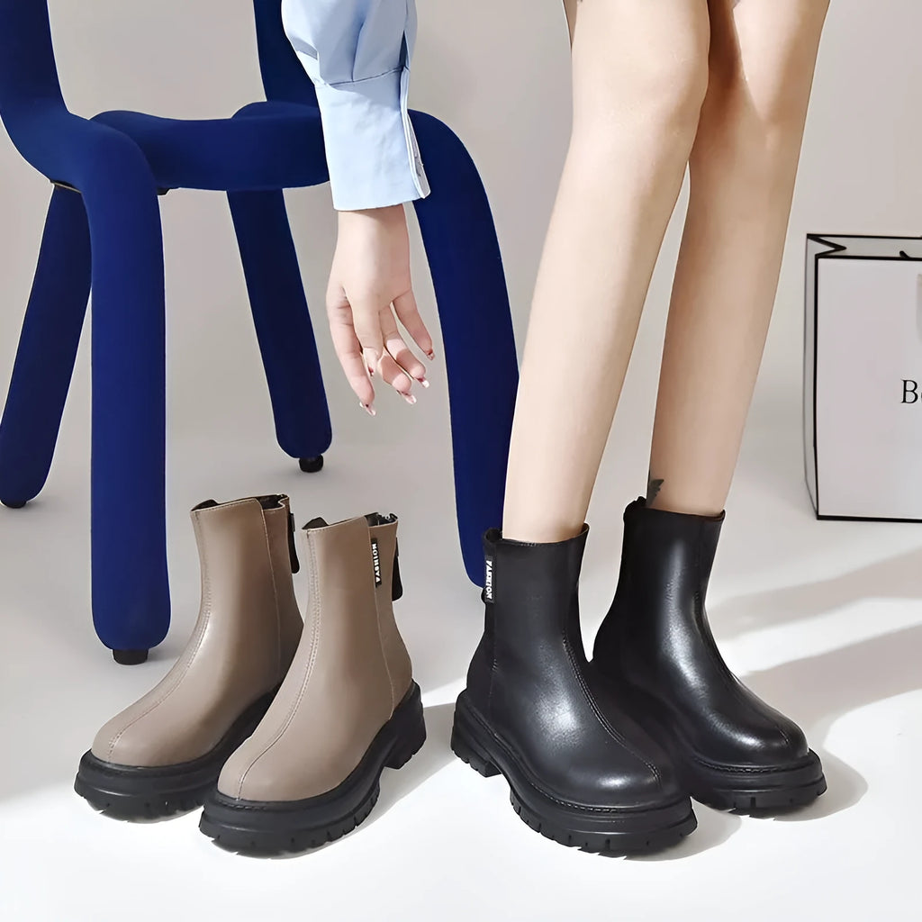 Large size women's platform Martin boots in solid black with rubber sole, low tube design