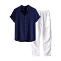 Man wearing a loose fit linen-look short sleeve shirt and matching casual trousers in a neutral colour.