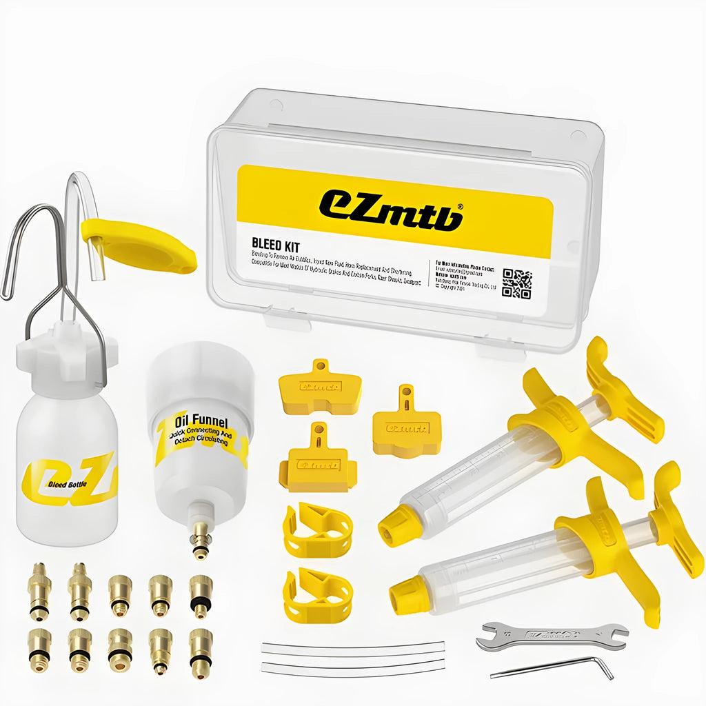 EZmtb bicycle hydraulic disc brake bleed kit with syringes, bottles, adapters, and tools laid out.