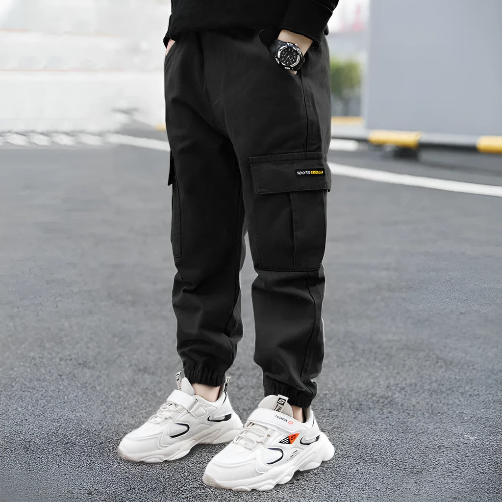 Boys' casual cotton summer trousers in khaki colour with elasticated waist, shown on size chart.