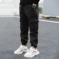 Boys' casual cotton summer trousers in khaki colour with elasticated waist, shown on size chart.