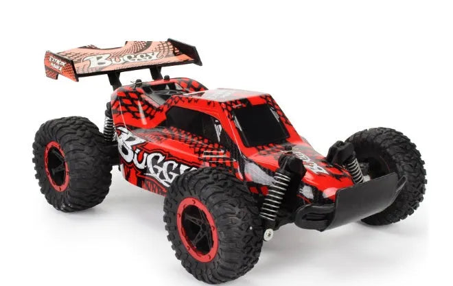 Blue 1:18 scale remote control off-road drift car with 2.4GHz remote on a grey surface.