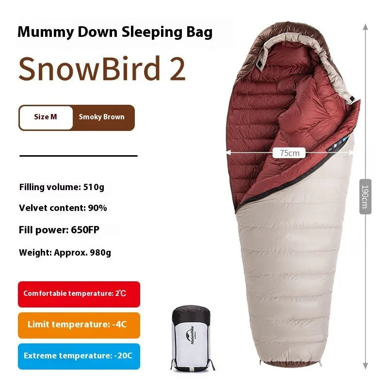 Adult mummy-style sleeping bag with goose down filling shown with its storage bag.