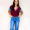 Burgundy women's V-neck loose sweater with contrast trim and cuffed short sleeves