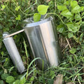 Silver coloured cast iron dumbbell cup for barbell, 8kg weight capacity.