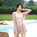Women's pink floral jumpsuit swimsuit with adjustable suspender straps on mannequin