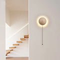 Semicircle yellow cave stone wall lamp with wooden bracket mounted on wall