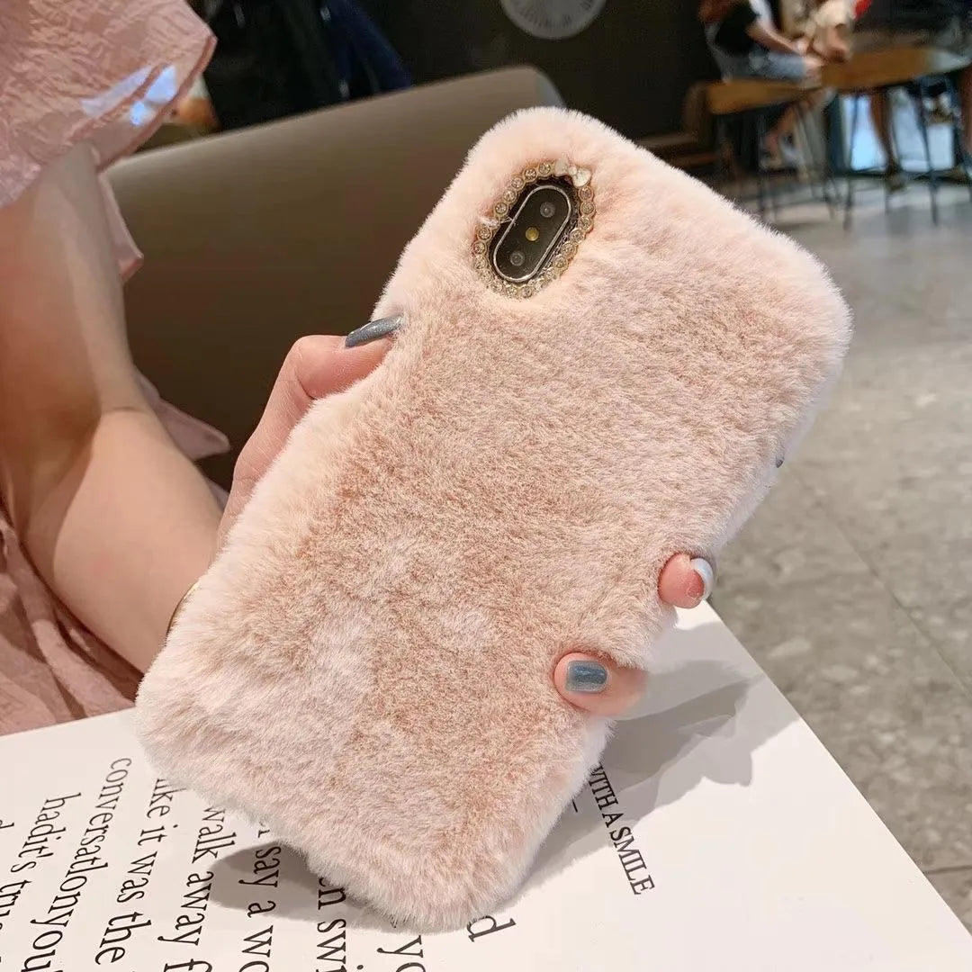 Silicone iPhone protective case with rhinestone decoration and a soft plush bottom shell.