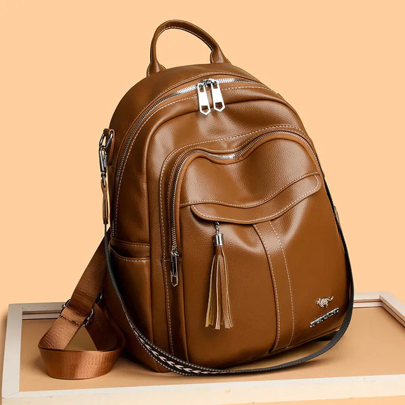 Genuine leather tassel backpack in khaki with fringe, stitching, anti-theft zippered hidden pocket and phone pocket