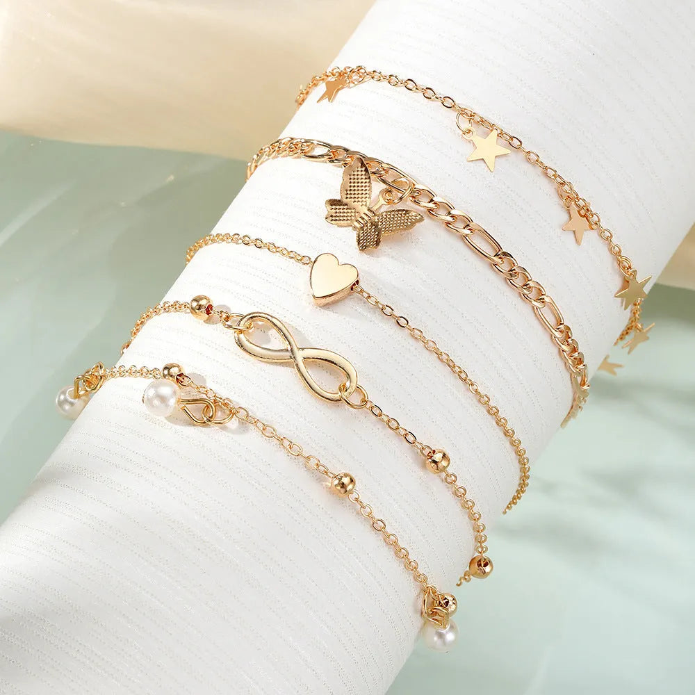 Butterfly pearl heart four-piece anklet set for women with multi-layer alloy chains