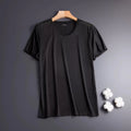 Men's solid colour ice silk short sleeve t-shirt in loose fit on a hanger.