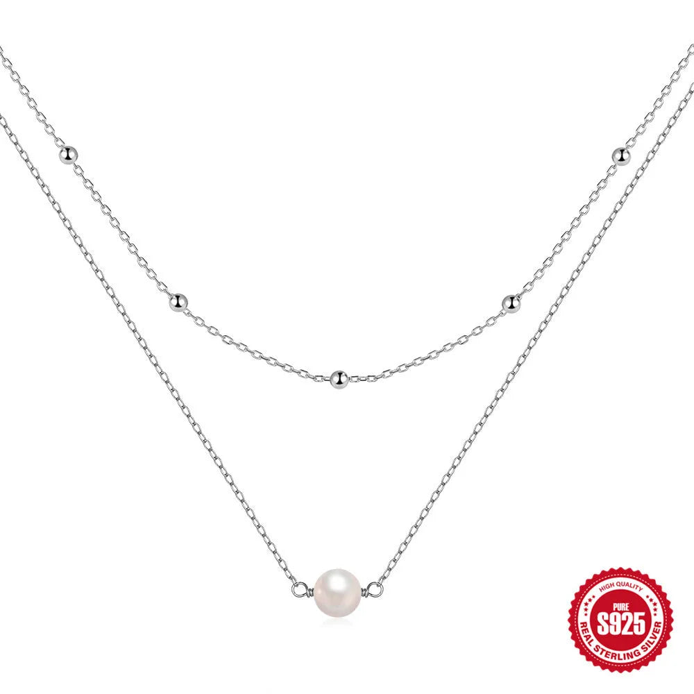 S925 sterling silver double layer pearl necklace with geometric pendant on a ball bead chain.