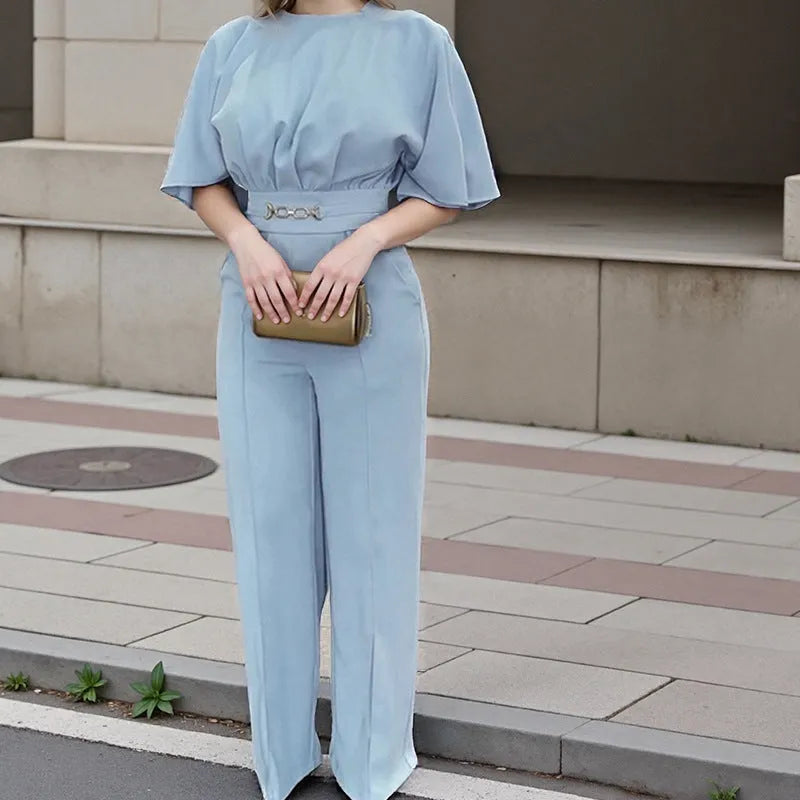 Blue polyester men's suit with long-sleeve jacket and trousers on a hanger.