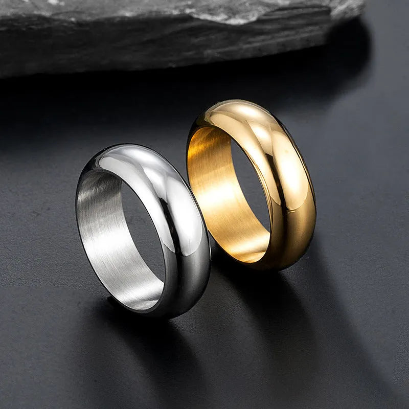 Glossy electroplated titanium steel ring shown in gold, black, and steel colour on a plain background.