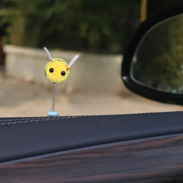 Small fur ball bee car decoration measuring 3cm square with cartoon design