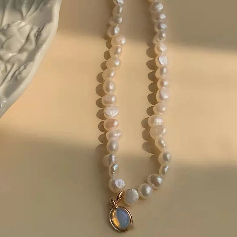 Geometric-shaped alloy necklace on a model, showing its adjustable chain length.
