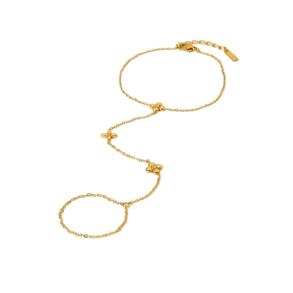 Gold geometric women's bracelet with floral and eight-pointed star design on stainless steel